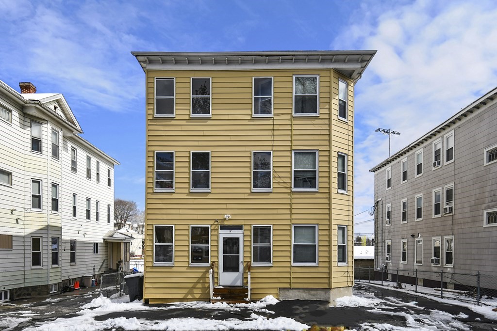 a front view of a house with many windows