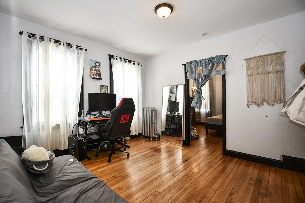 97 Arthur Street Worcester, MA 01604 - Photo 17 of 42 a living room with furniture and a wooden floor