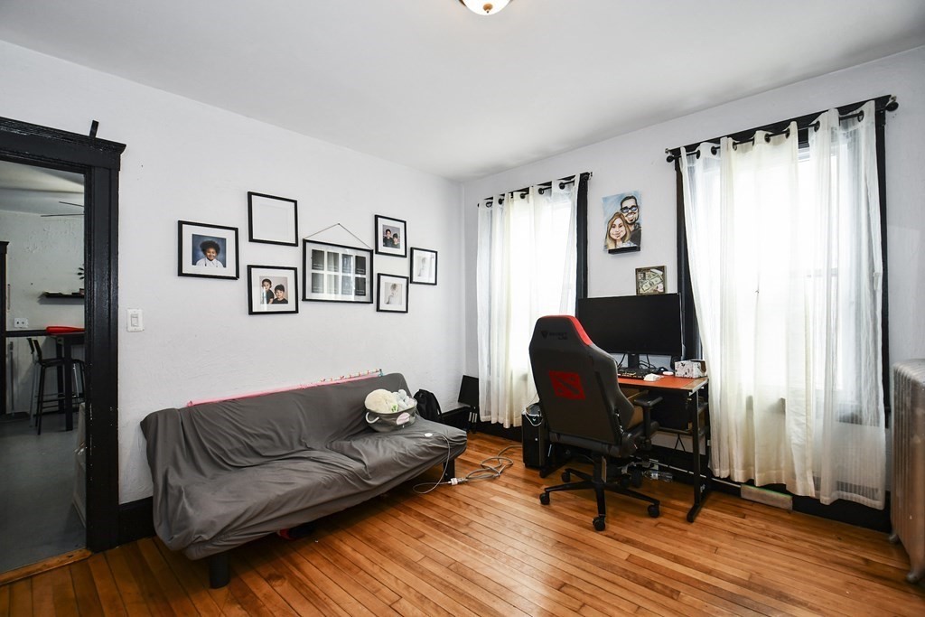 97 Arthur Street Worcester, MA 01604 - Photo 18 of 42 a living room with furniture a piano and a window