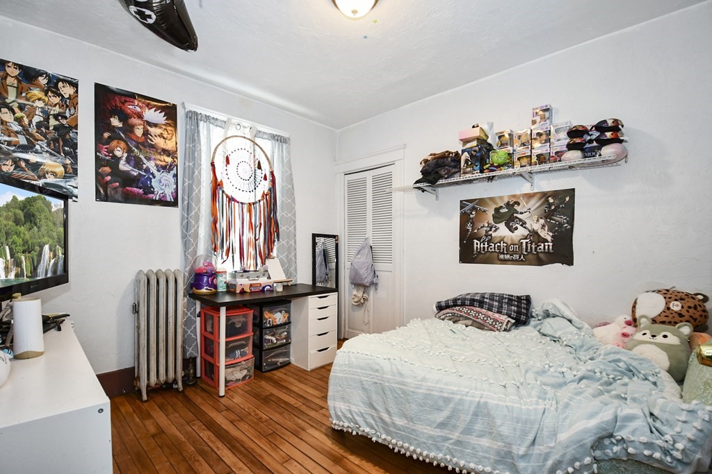 97 Arthur Street Worcester, MA 01604 - Photo 19 of 42 a bedroom with a bed and a flat screen tv