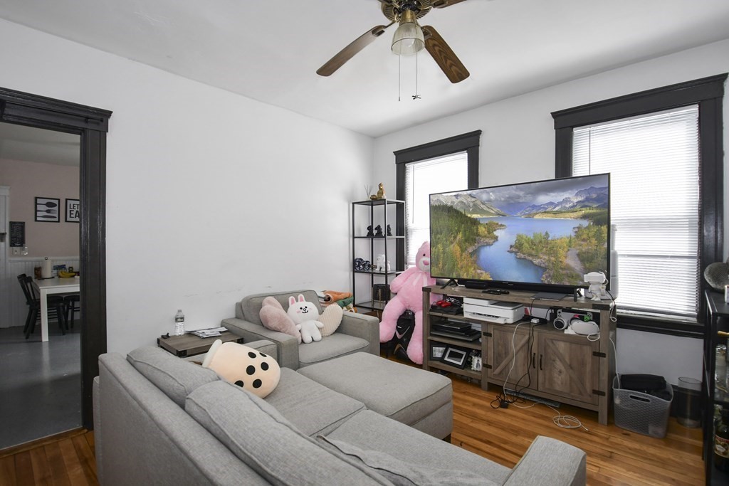 97 Arthur Street Worcester, MA 01604 - Photo 24 of 42 a living room with furniture and a flat screen tv