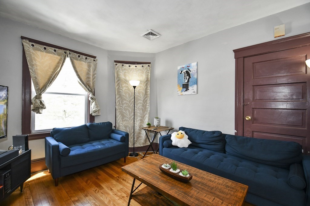 97 Arthur Street Worcester, MA 01604 - Photo 3 of 42 a living room with furniture and a window