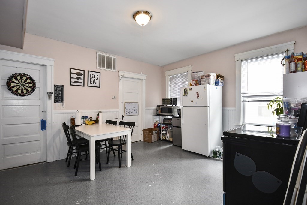 97 Arthur Street Worcester, MA 01604 - Photo 32 of 42 a view of a workspace with furniture and a window