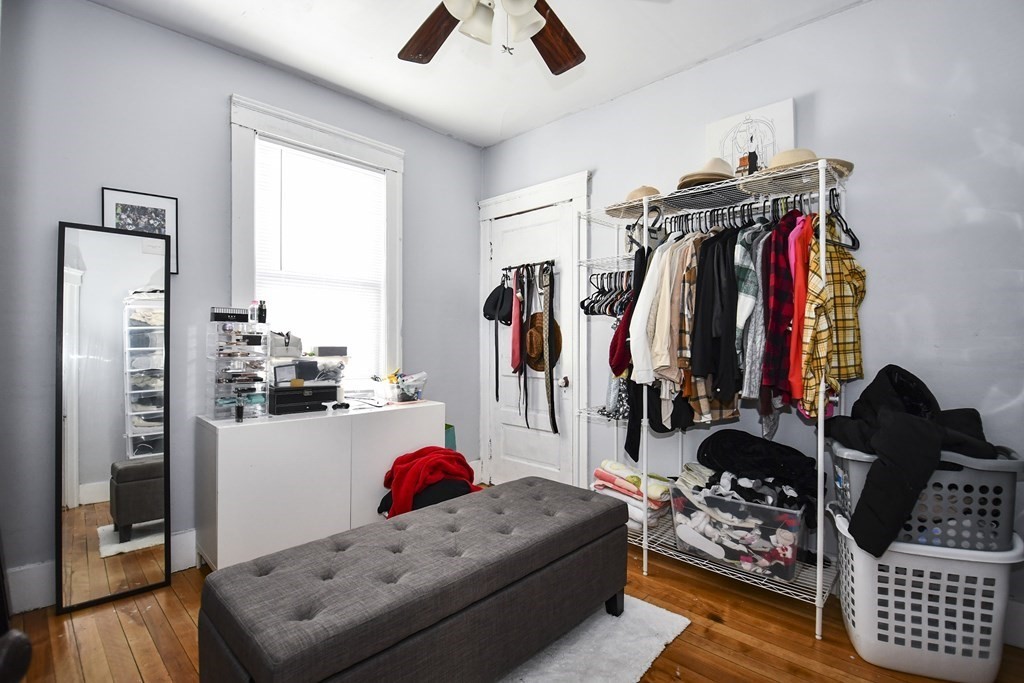 97 Arthur Street Worcester, MA 01604 - Photo 34 of 42 a living room with lots of furniture and clothes