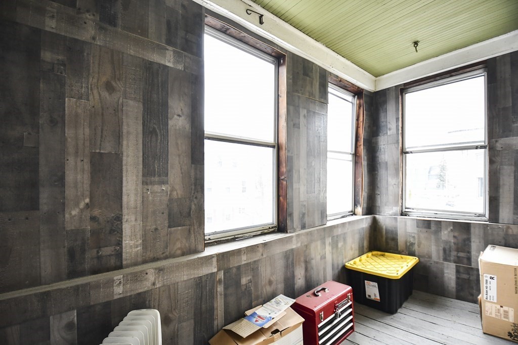 97 Arthur Street Worcester, MA 01604 - Photo 36 of 42 a bathroom with a sink and mirror with bathtub