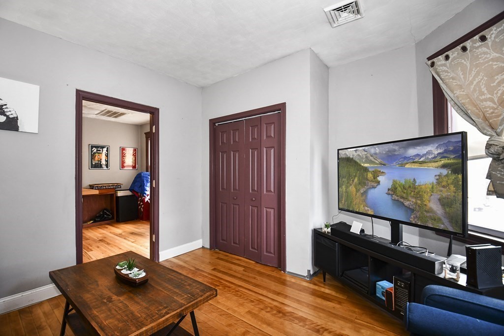 97 Arthur Street Worcester, MA 01604 - Photo 4 of 42 a living room with furniture and a flat screen tv
