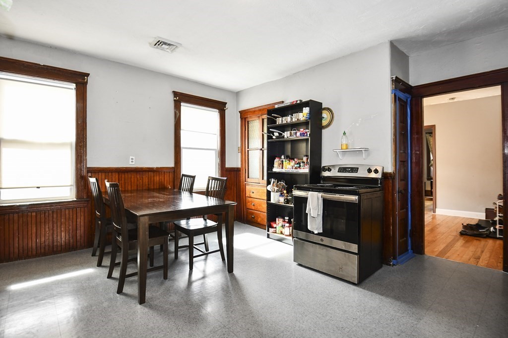 97 Arthur Street Worcester, MA 01604 - Photo 6 of 42 a view of a dining room with furniture and a window