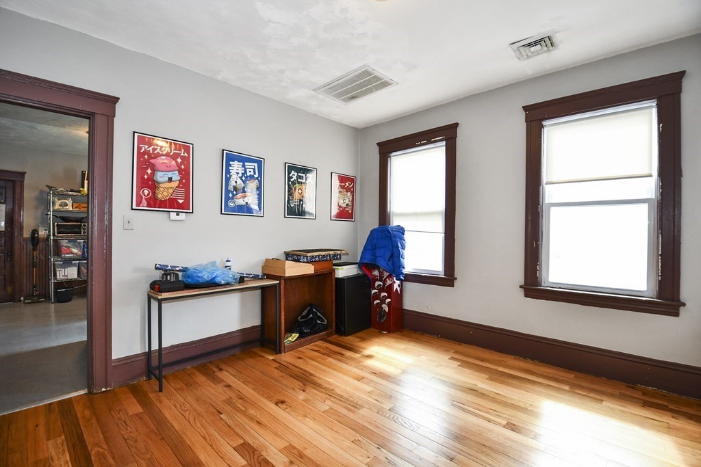 97 Arthur Street Worcester, MA 01604 - Photo 10 of 42 a room with furniture and a window