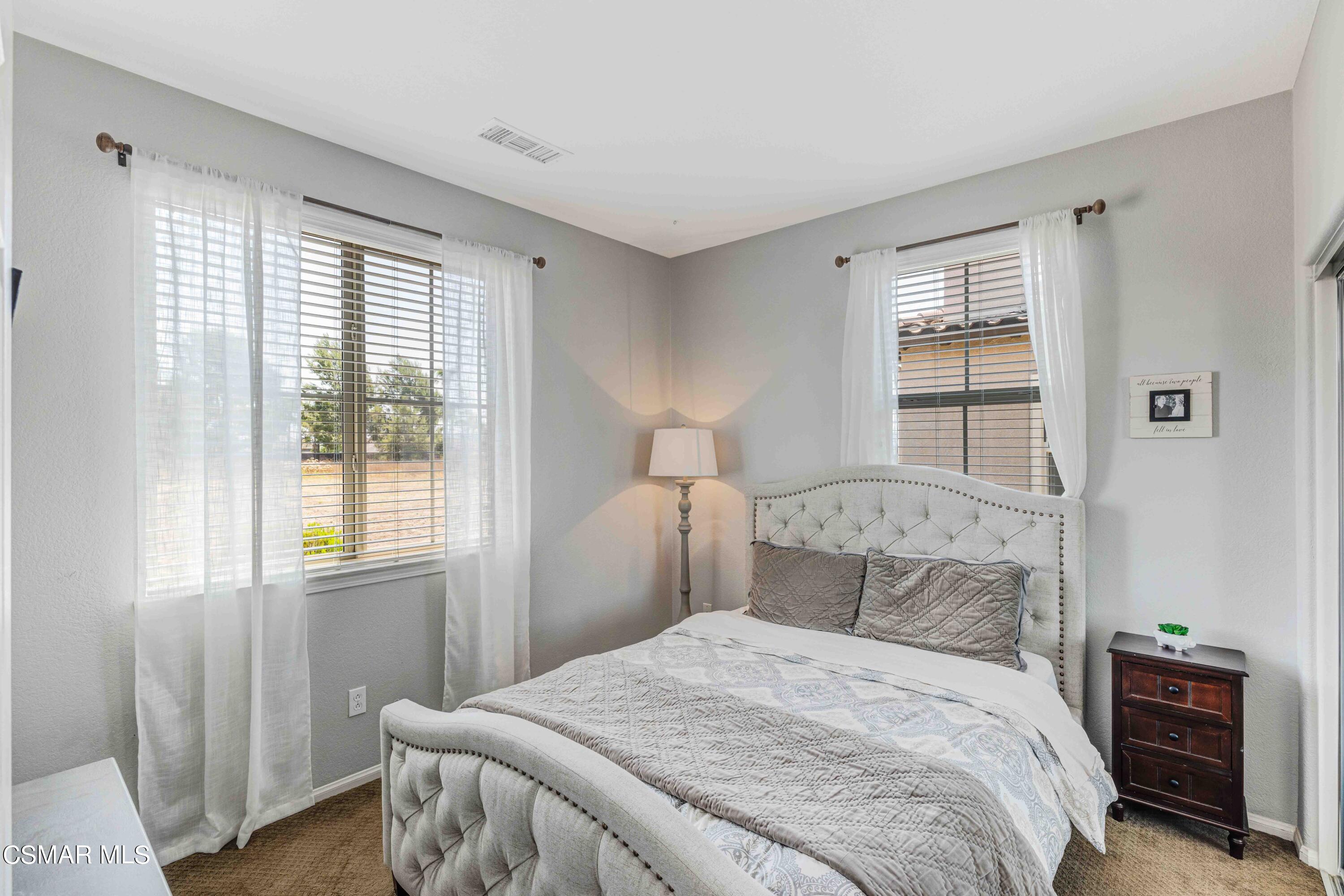 6802 Simmons Way Moorpark, CA 93021 - Photo 14 of 36 a bedroom with a bed and a window