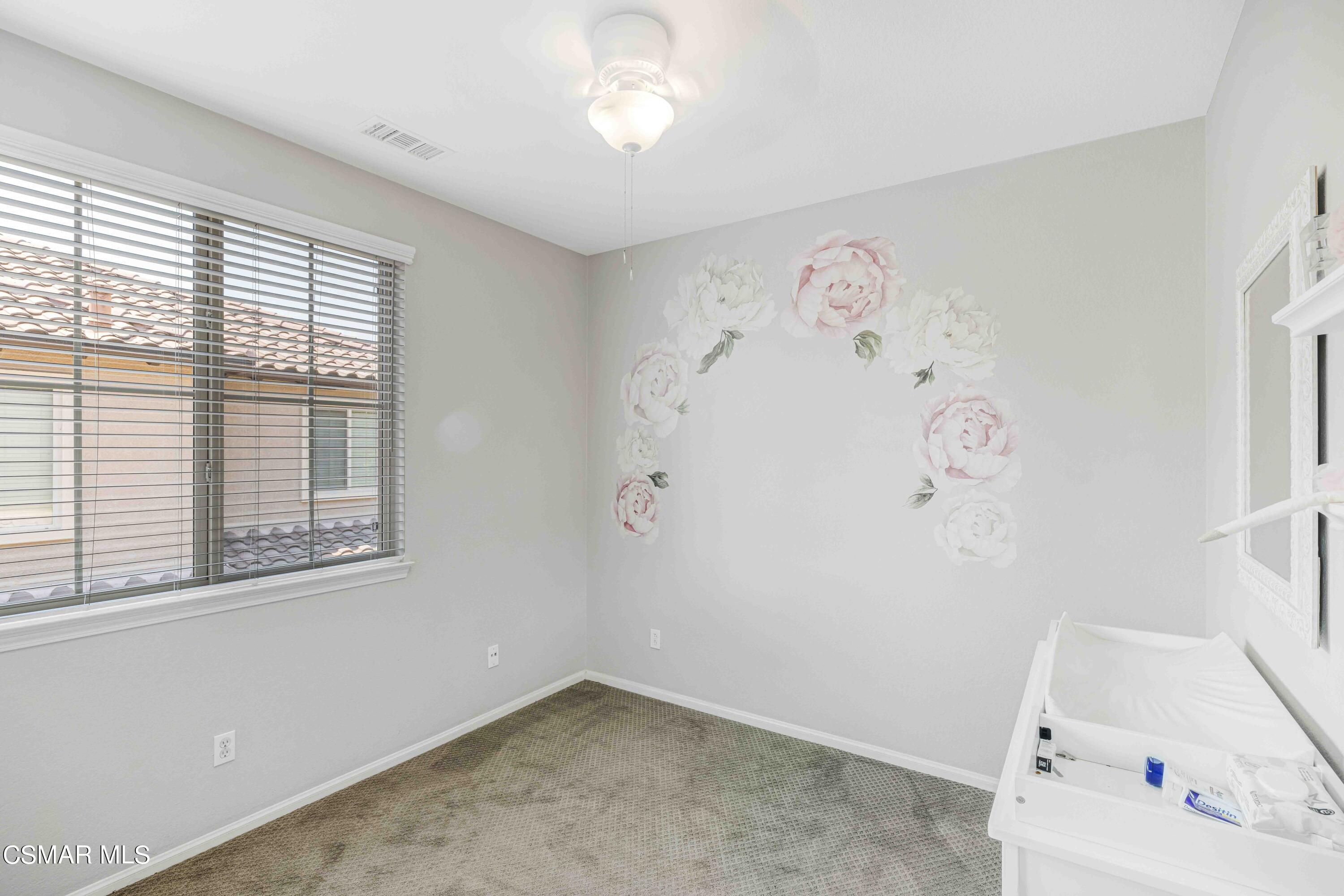 6802 Simmons Way Moorpark, CA 93021 - Photo 15 of 36 a view of a room with baby crib and a window