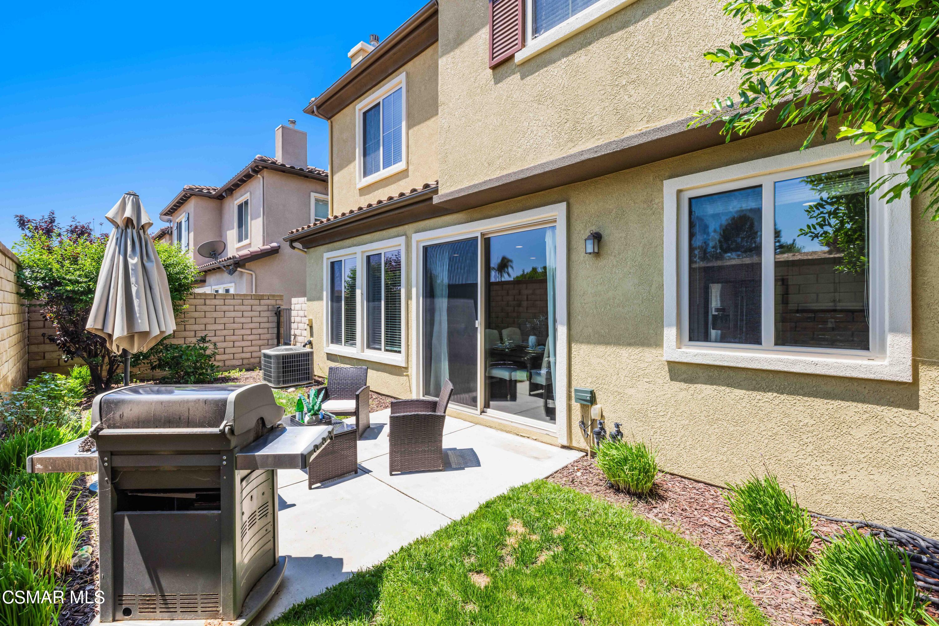 6802 Simmons Way Moorpark, CA 93021 - Photo 24 of 36 a view of a house with sitting area and garden
