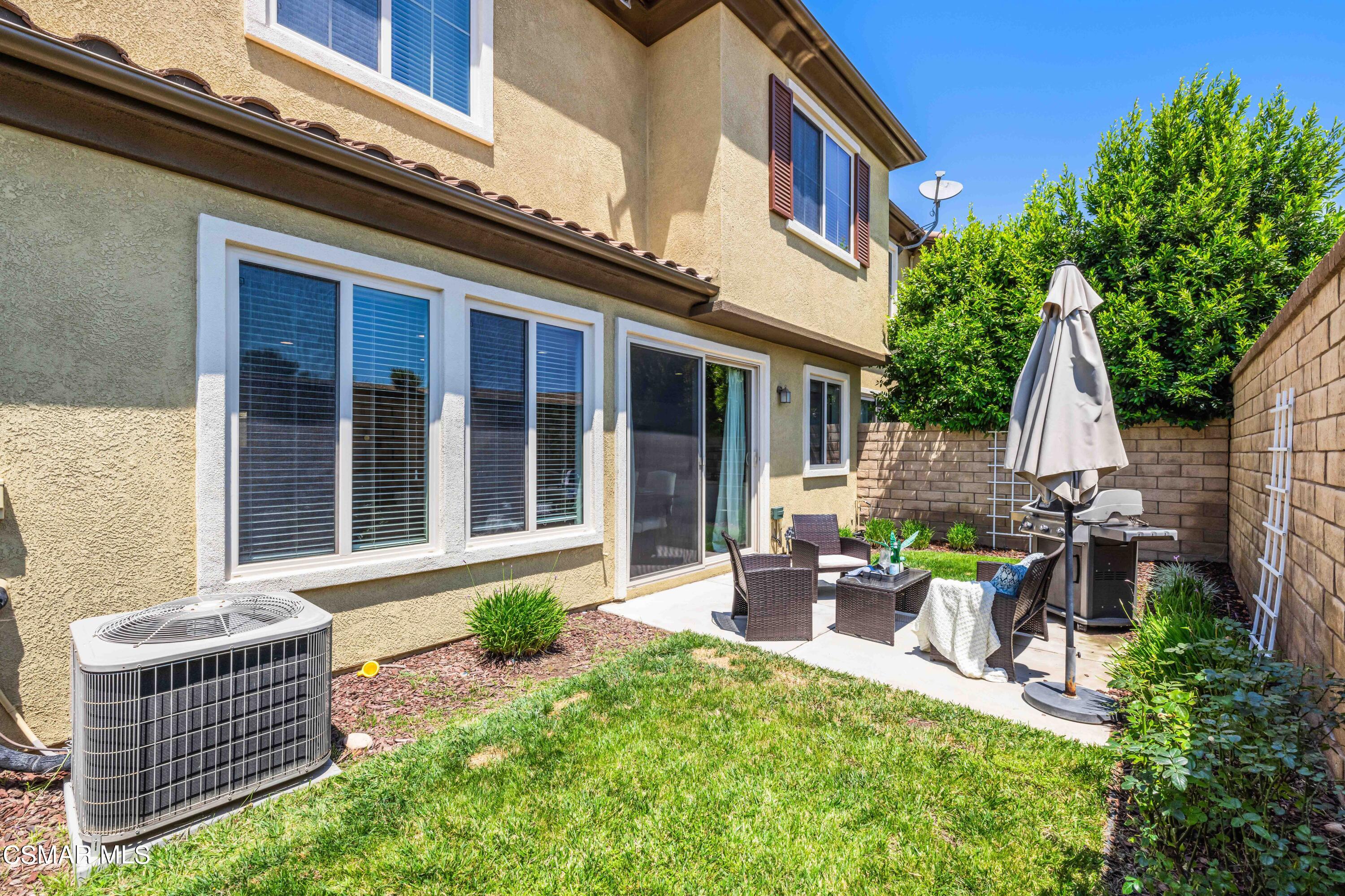 6802 Simmons Way Moorpark, CA 93021 - Photo 26 of 36 a view of a house with backyard and sitting area
