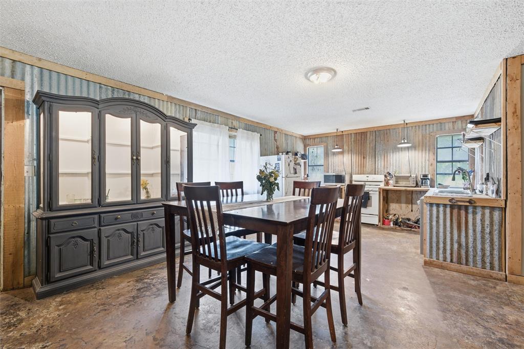 3122 Gun Club Road Temple, TX 76501 - Photo 9 of 22 a view of a dining room with furniture window and wooden floor