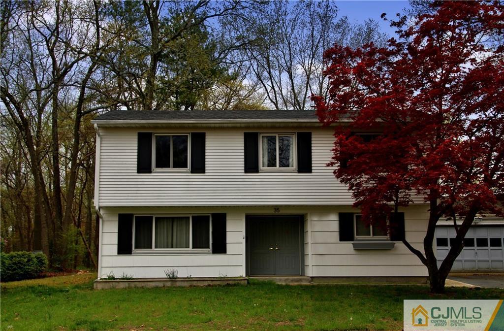35 Rieder Road Spotswood, NJ 08884 - Photo 1 of 25 a front view of a house with garden
