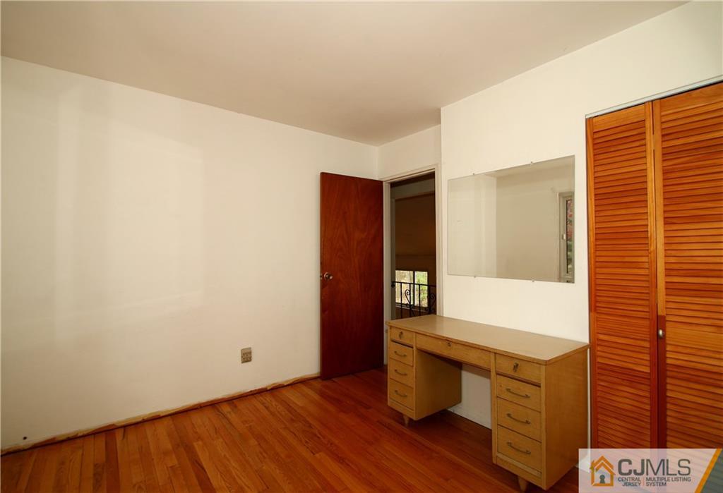 35 Rieder Road Spotswood, NJ 08884 - Photo 12 of 25 a view of an empty room with wooden floor and a window