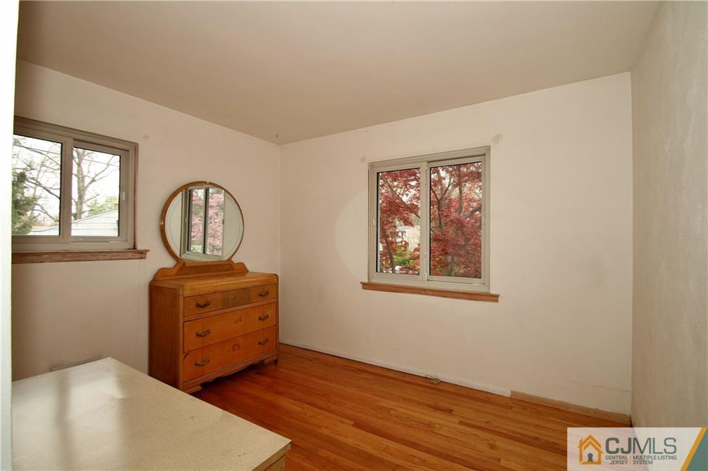 35 Rieder Road Spotswood, NJ 08884 - Photo 13 of 25 a room with chandelier fan and wooden floor