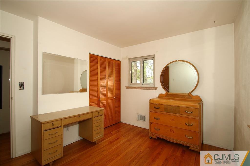 35 Rieder Road Spotswood, NJ 08884 - Photo 14 of 25 a room with dresser mirror and window