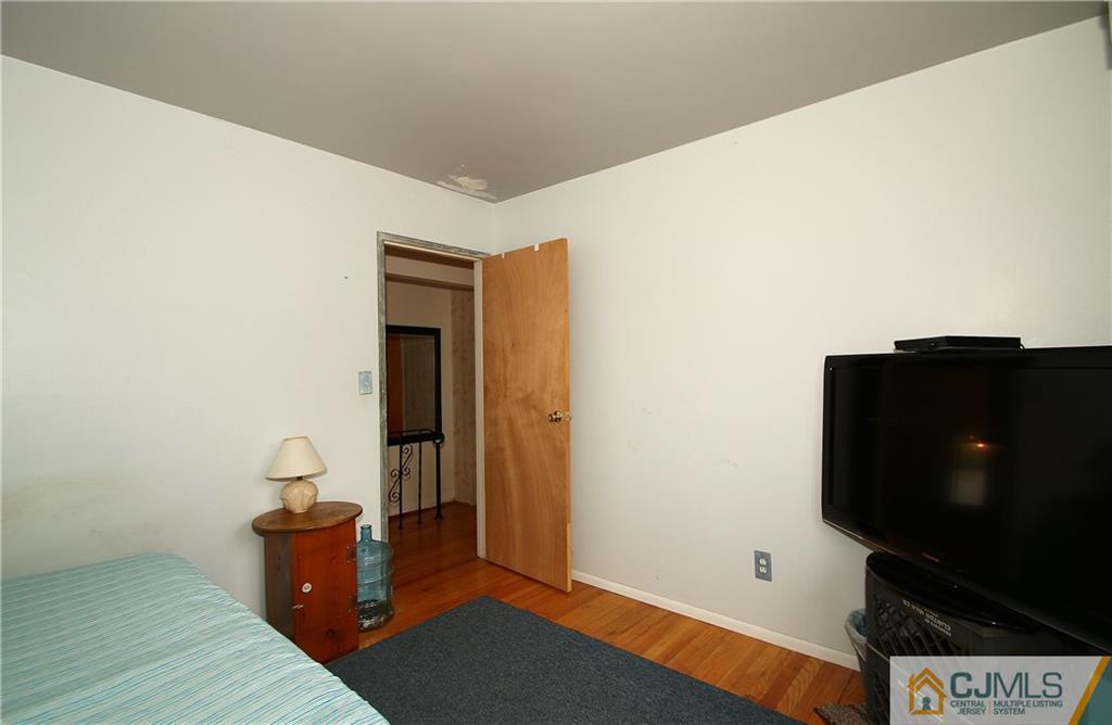 35 Rieder Road Spotswood, NJ 08884 - Photo 15 of 25 a living room with furniture and a flat screen tv