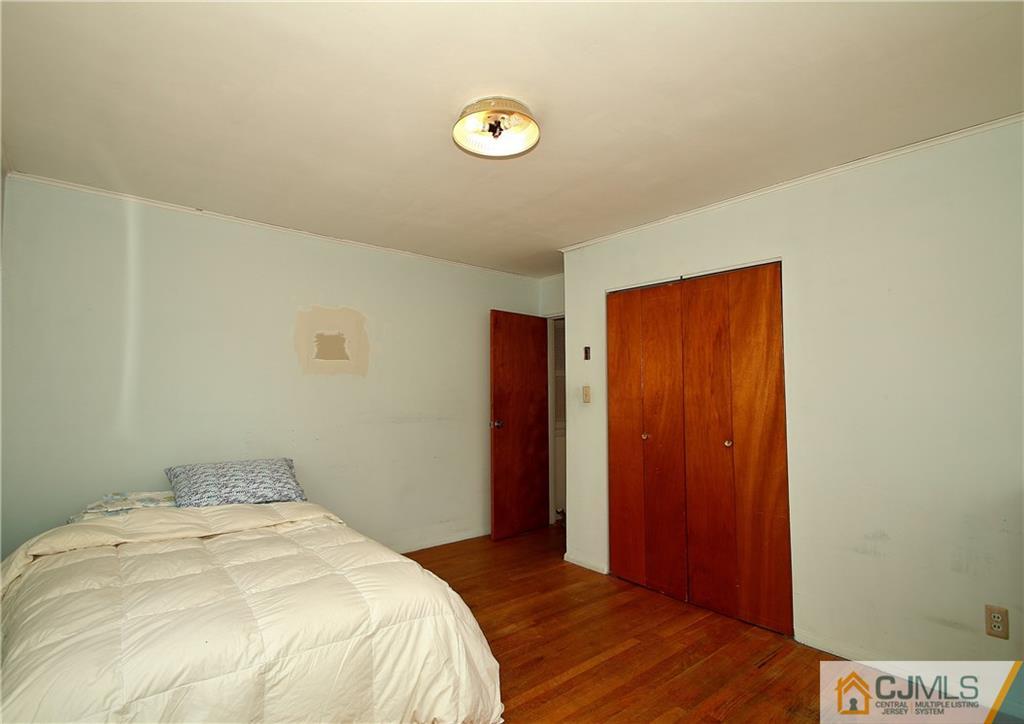 35 Rieder Road Spotswood, NJ 08884 - Photo 19 of 25 a bedroom with a bed and a closet