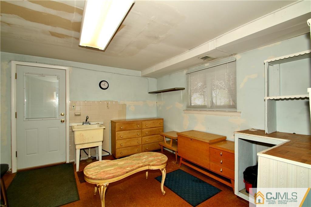 35 Rieder Road Spotswood, NJ 08884 - Photo 22 of 25 a room with furniture a rug and a window