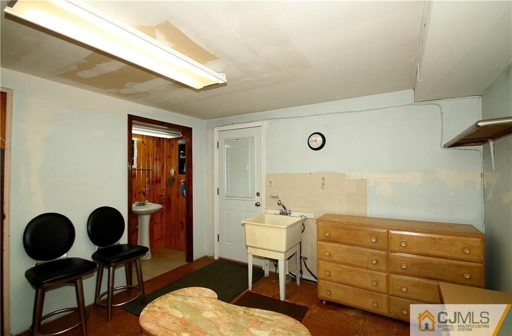35 Rieder Road Spotswood, NJ 08884 - Photo 23 of 25 a room with furniture and wooden floor