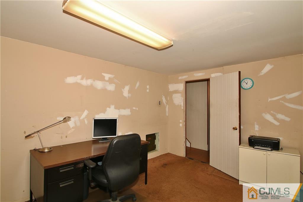 35 Rieder Road Spotswood, NJ 08884 - Photo 25 of 25 a workspace with furniture and chandelier