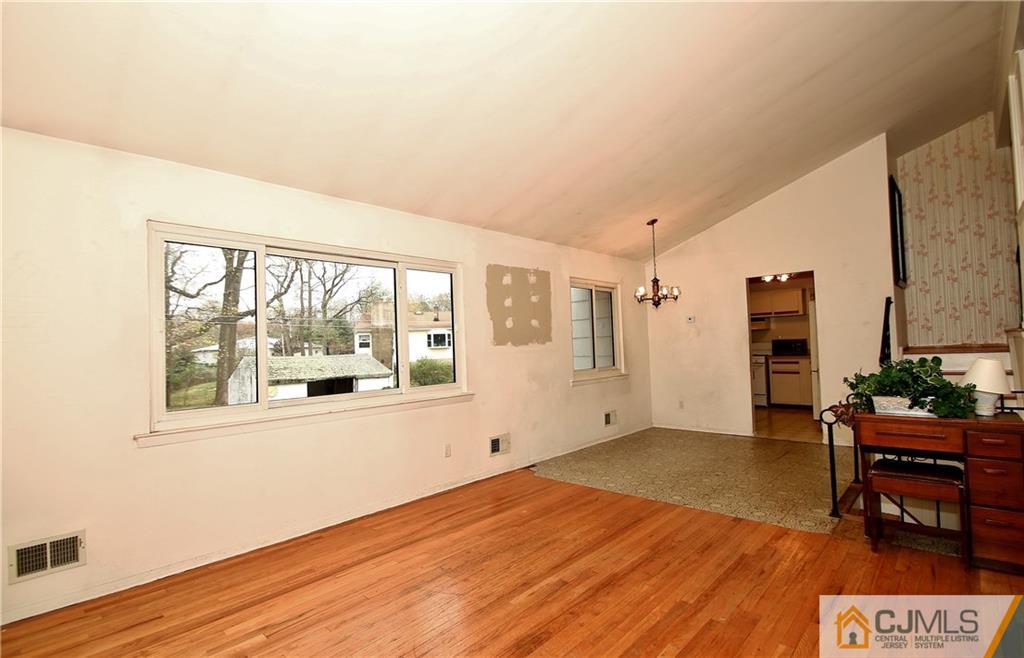 35 Rieder Road Spotswood, NJ 08884 - Photo 8 of 25 a view of an empty room with wooden floor and a window