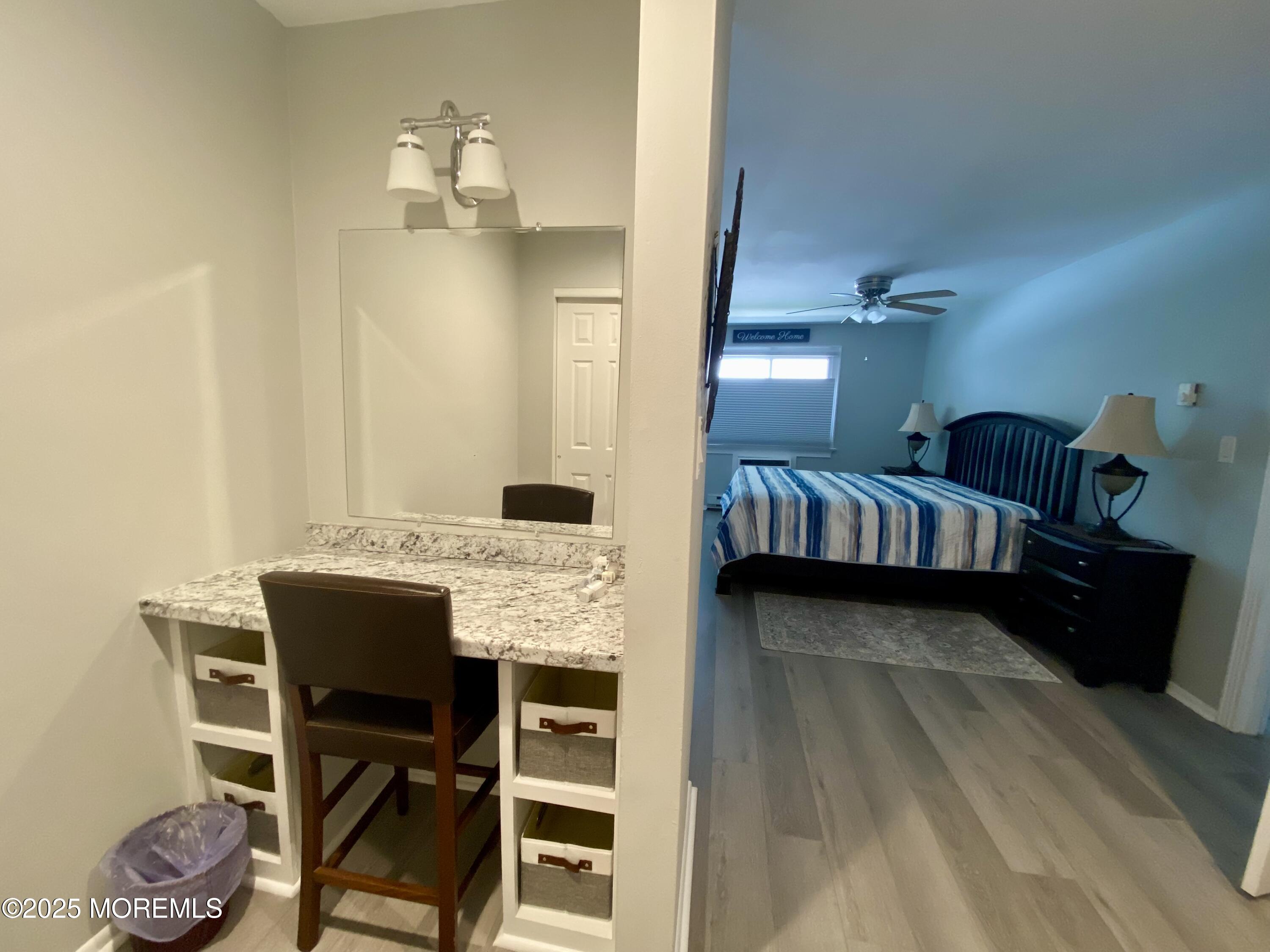 260 Ocean Avenue, Unit A18 Sea Bright, NJ 07760 - Photo 14 of 19 a view of hall way with furniture and chandelier