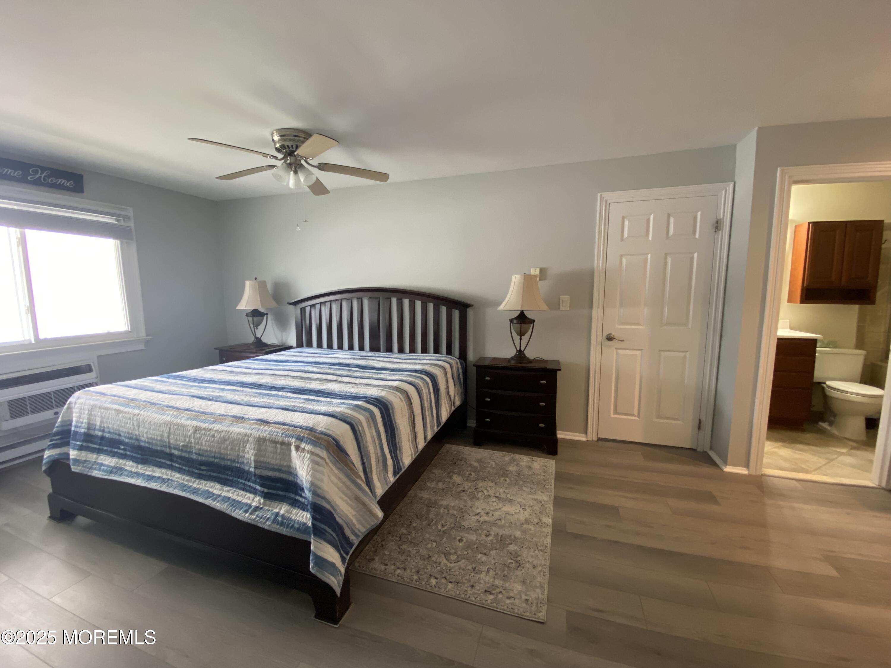 260 Ocean Avenue, Unit A18 Sea Bright, NJ 07760 - Photo 15 of 19 a spacious bedroom with a bed and a table