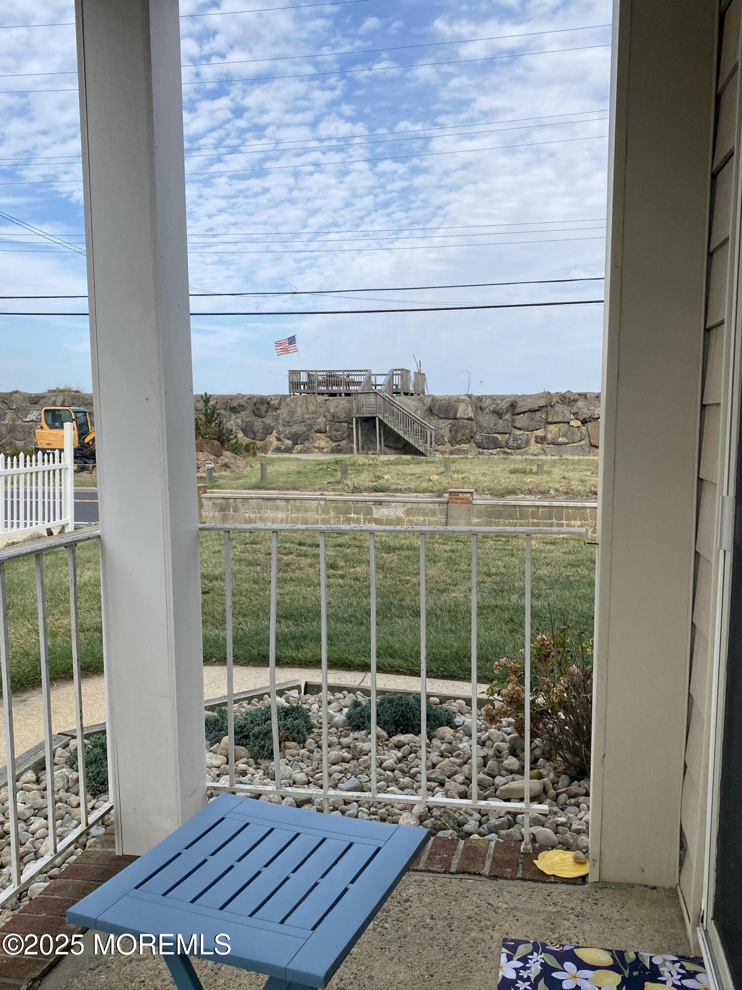 260 Ocean Avenue, Unit A18 Sea Bright, NJ 07760 - Photo 4 of 19 a table and chair sitting in a room
