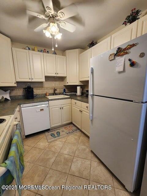 260 Ocean Avenue, Unit A18 Sea Bright, NJ 07760 - Photo 6 of 19 a kitchen with a sink a refrigerator and cabinets