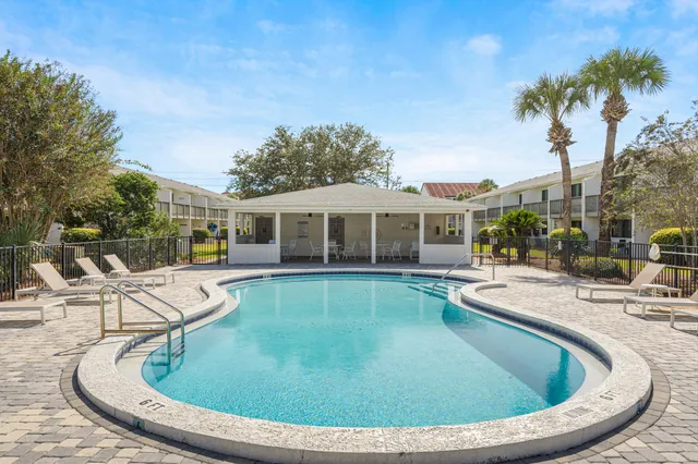 a view of a swimming pool with a patio