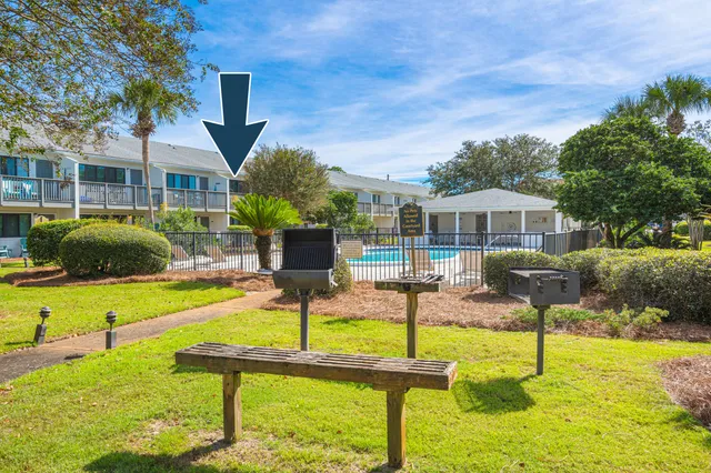 view of a swimming pool with outdoor seating