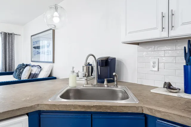 a kitchen with a stove and a refrigerator