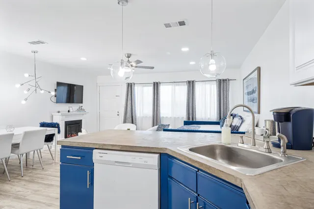 a kitchen with a stove and cabinets