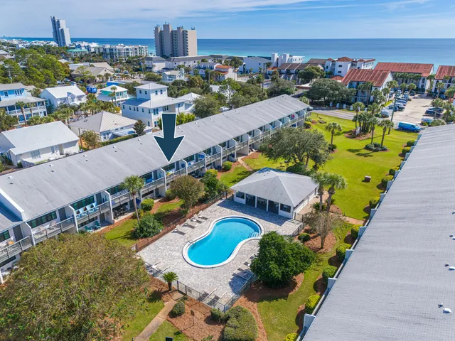 an aerial view of a swimming pool patio and mountain view