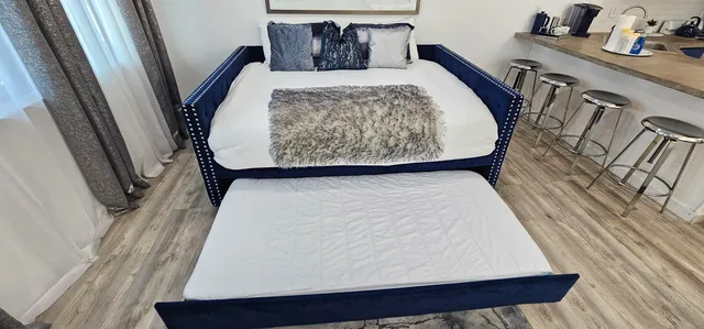 a bedroom with a bed and window