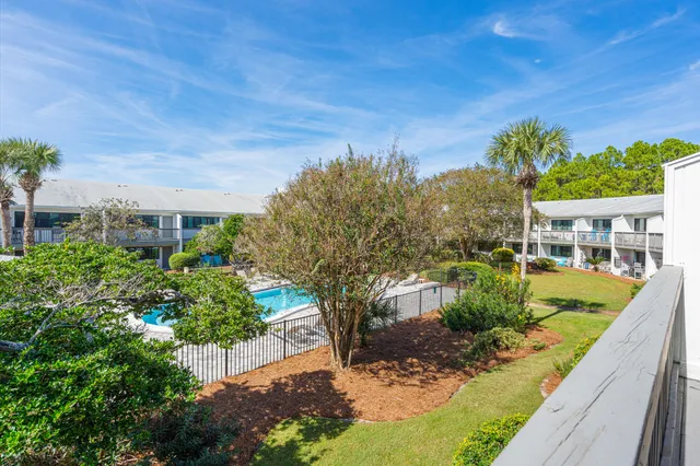 a view of a balcony with wooden floor