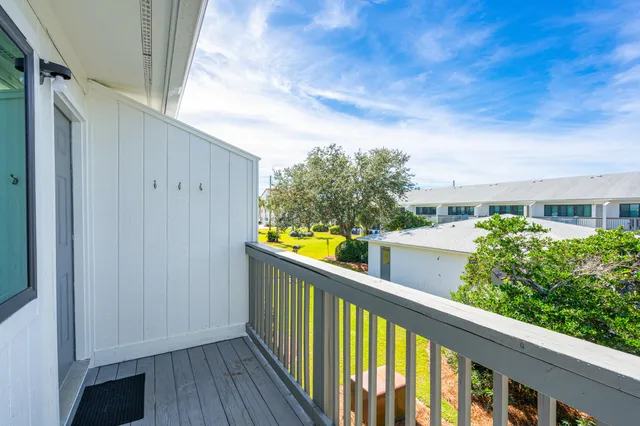 a view of a house with swimming pool and sitting area