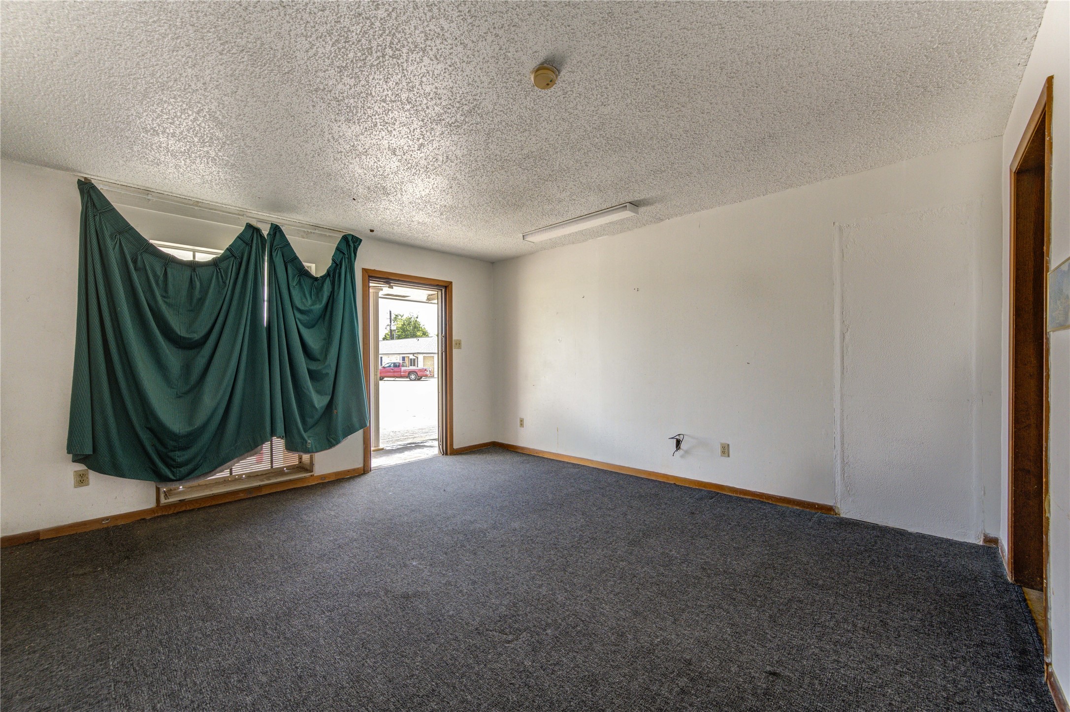 4602 Avenue H Rosenberg, TX 77471 - Photo 33 of 42 a view of an empty room with wooden floor and windows