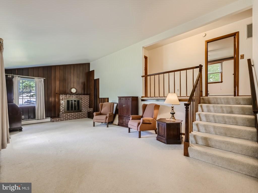 607 Plumtree Road Bel Air, MD 21015 - Photo 6 of 41 Living Room with Vaulted Ceiling and Fireplace