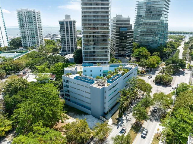 a view of a garden with sitting area