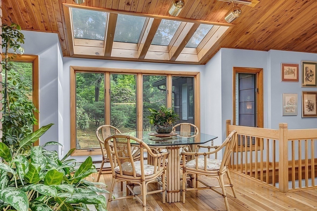 4 Belfast Road Peabody, MA 01960 - Photo 15 of 34 a view of a dining room with furniture large windows and wooden floor