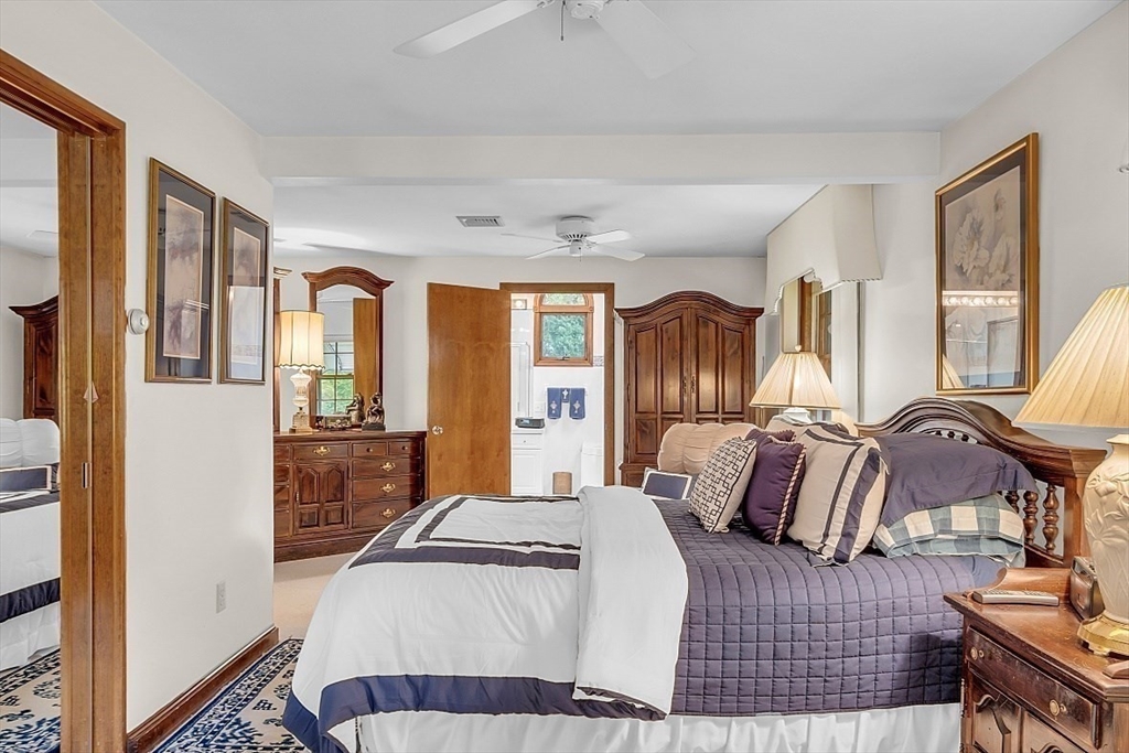 4 Belfast Road Peabody, MA 01960 - Photo 18 of 34 a bedroom with a bed and glass door