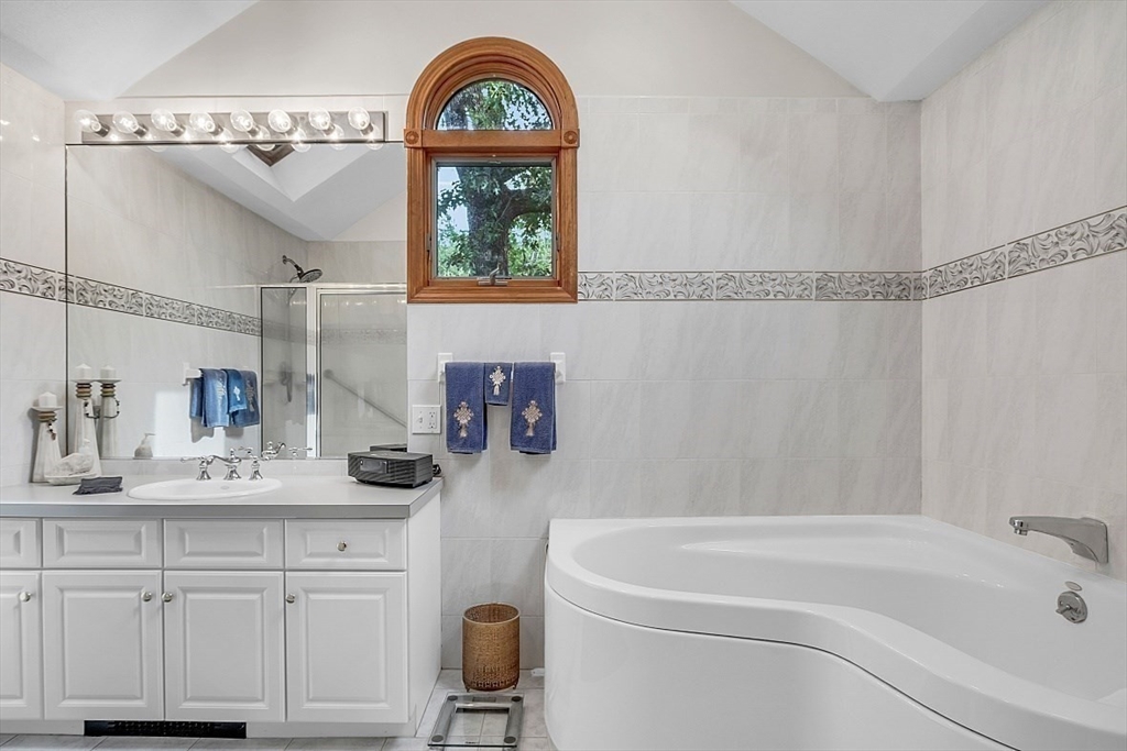 4 Belfast Road Peabody, MA 01960 - Photo 20 of 34 a bathroom with a sink a toilet and a bathtub