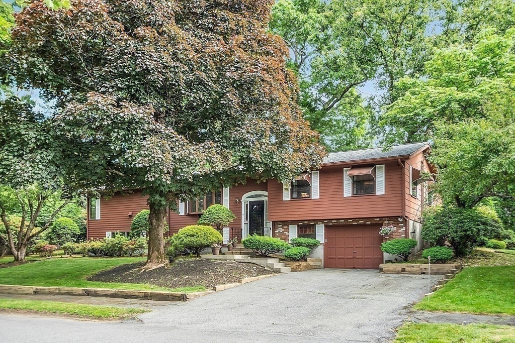 4 Belfast Road Peabody, MA 01960 - Photo 2 of 34 a front view of a house with a yard and a garage