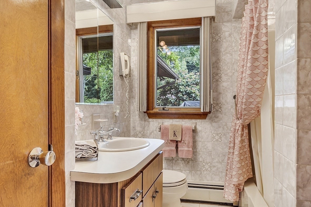4 Belfast Road Peabody, MA 01960 - Photo 23 of 34 a bathroom with a sink toilet and tub