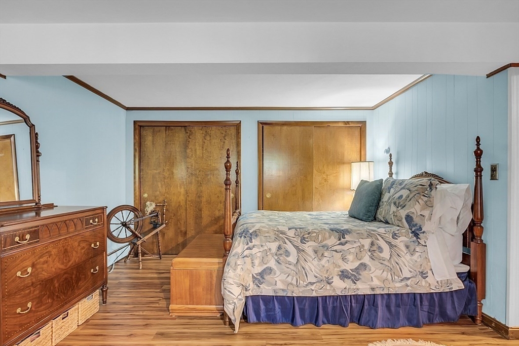 4 Belfast Road Peabody, MA 01960 - Photo 24 of 34 a bedroom with a bed and wooden floor