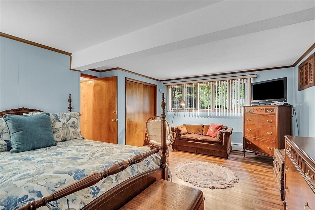 4 Belfast Road Peabody, MA 01960 - Photo 25 of 34 a bedroom with a bed and flat screen tv