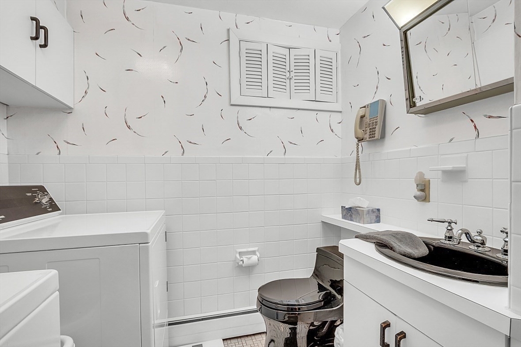 4 Belfast Road Peabody, MA 01960 - Photo 26 of 34 a bathroom with a sink and a toilet